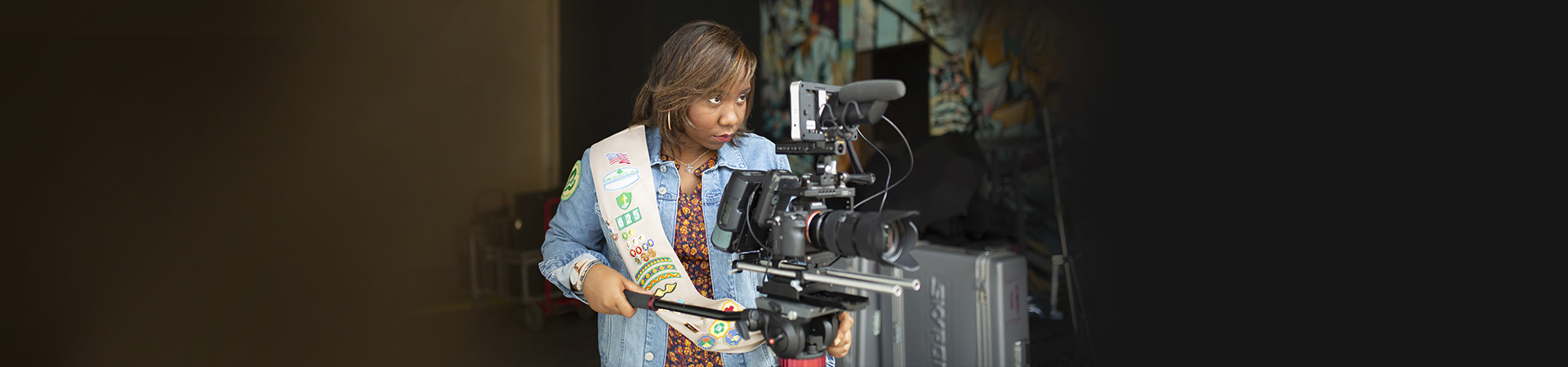  Ambassador Girl Scout using a film camera 