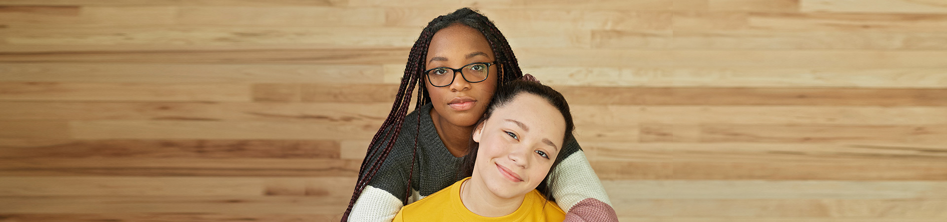  Two Girl Scouts sitting and hugging 
