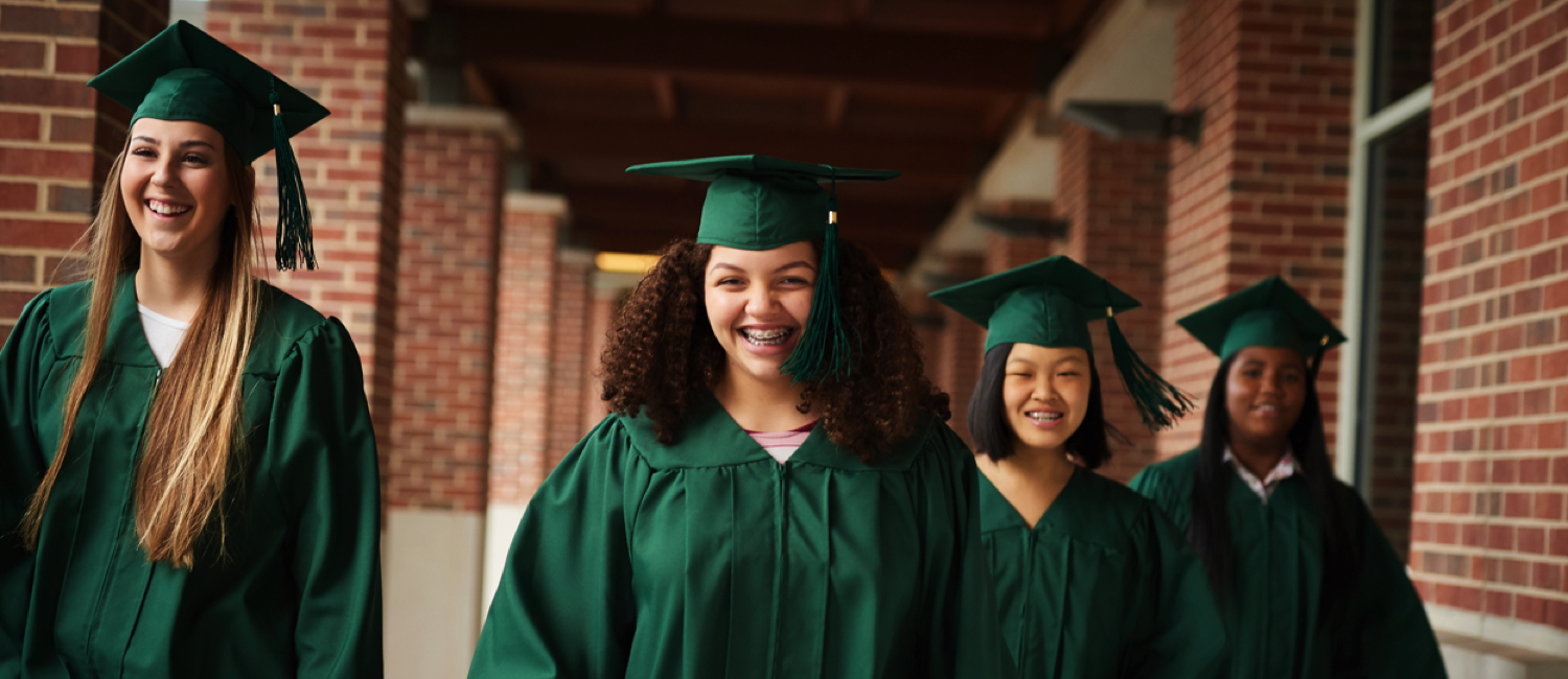  Group of four girls in their graduation regalia 